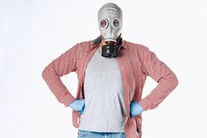 Portrait of a man in a gas mask. Panic during quarantine. Coronavirus pandemia photo