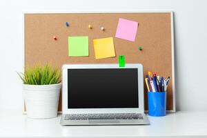 Work place of a creative person with a variety of colorful stationery objects photo