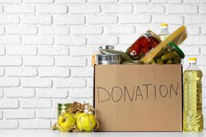 Donation box with various food. Pandemic support. photo
