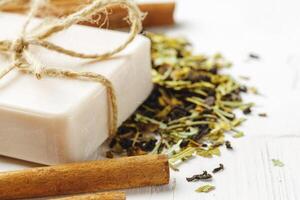 handmade soap with cinnamon on the table photo