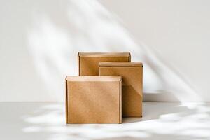 Freshly packed cardboard boxes resting on a white surface, illuminated by soft natural light photo