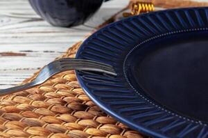 Wooden kitchen counter with new dishware on it photo