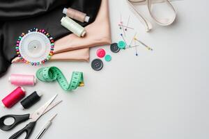 Crafting essentials for sewing projects displayed on a table with fabric, threads, and tools photo