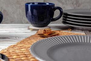 Still life photo of empty tea cup with honey spoon