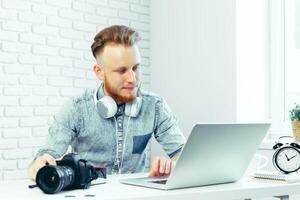 Photographer selecting photos on his computer