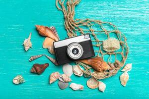 Old retro camera on wooden table background photo