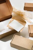 Delivery package with a blank envelope and decorative elements on a light background photo