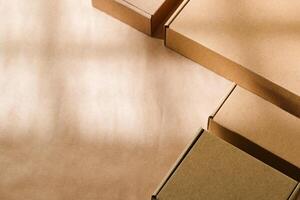 Brown cardboard boxes arranged on a neutral background in a warehouse setting during daylight hours photo