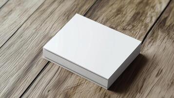Blank business cards on a rustic wooden surface ready for customization and branding in a creative workspace photo