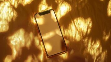 A sleek smartphone resting on a golden surface illuminated by soft golden light during a peaceful afternoon photo