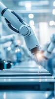 Robotic arm performing precision welding in an automated manufacturing facility during daytime operations photo