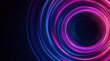 Colorful light trails create dynamic circular patterns in a dark setting, showcasing vibrant hues of pink and blue photo