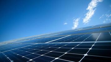 Solar panels under a clear blue sky showcasing renewable energy technology on a sunny day in a rural area photo