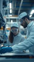 Two engineers collaborate on a technical project in a modern laboratory during a daytime research session photo