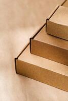 Stacked cardboard boxes on a neutral background in a shipping or packaging setting photo