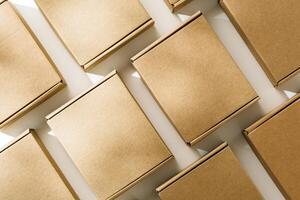 Brown cardboard boxes arranged on a neutral background in a warehouse setting during daylight hours photo