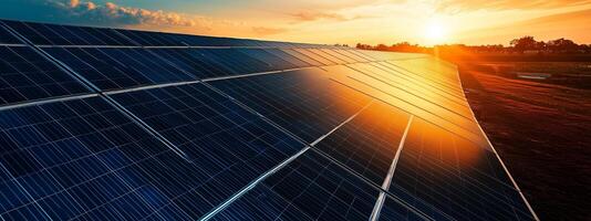 Sunset over a solar panel array in a rural setting showcasing renewable energy technology at dusk photo