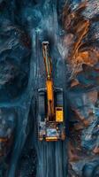 Heavy machinery working on a mining site in a rocky terrain during daylight hours photo
