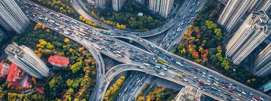 Busy urban intersection view from above showcases traffic flow and city development during fall in a metropolitan area photo