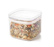 Nutritious seed mix served in a bowl with additional snacks for pet at home photo