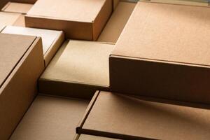 Stacked cardboard boxes arranged in a neat pattern under natural light photo