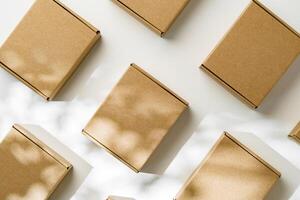 Brown cardboard boxes arranged on a light surface for packing goods in a warehouse setting photo