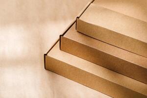 Stacked cardboard boxes on a neutral background in a shipping or packaging setting photo