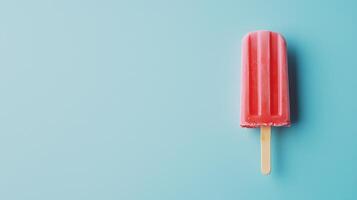 Refreshing summer popsicle resting on a light blue background, capturing the essence of a sunny afternoon treat photo