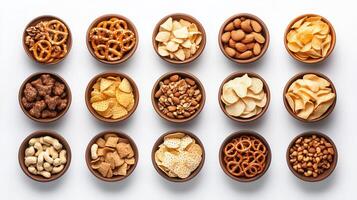 Variety of snacks displayed in bowls arranged in a neat grid showcasing colorful options for parties or gatherings photo
