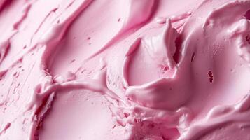 Delicious pink ice cream swirled with creamy texture in an enticing dessert display at a summer festival photo