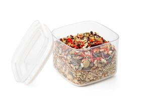 Nutritious seed mix served in a bowl with additional snacks for pet at home photo