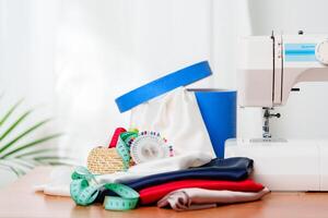 A sewing machine with colorful threads and fabric in a bright crafting space for creative projects photo