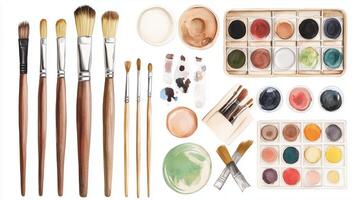 Art supplies arranged neatly with various paint colors and brushes on a white background for a creative project photo