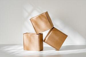 Freshly packed cardboard boxes resting on a white surface, illuminated by soft natural light photo