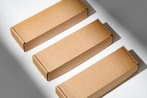 Freshly packed cardboard boxes resting on a white surface, illuminated by soft natural light photo