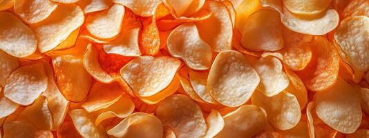 Crunchy potato chips arranged in a colorful pattern highlighting their texture and golden hue for a delightful snack experience photo