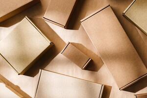 Multiple cardboard boxes arranged on a surface for packaging and shipping in a warehouse setting photo