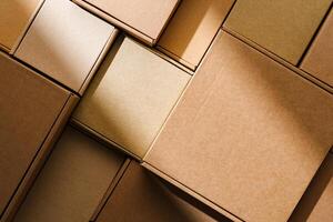 Stacked cardboard boxes arranged in a neat pattern under natural light photo