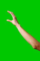 A womans hand extends upward into the air, fingers outstretched, reaching upward towards an unseen destination. photo