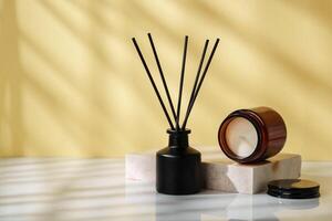 Elegant Reed Diffuser and Scented Candle on a Modern Desk at Golden Hour photo