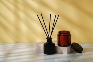 Elegant Reed Diffuser and Scented Candle on a Modern Desk at Golden Hour photo