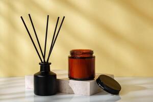Elegant Reed Diffuser and Scented Candle on a Modern Desk at Golden Hour photo
