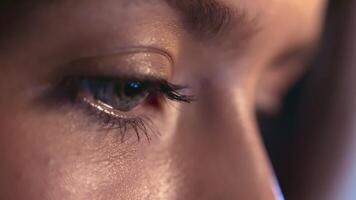 A detailed close-up showcasing the eye of a person, emphasizing texture and the play of light on the lashes and skin. video