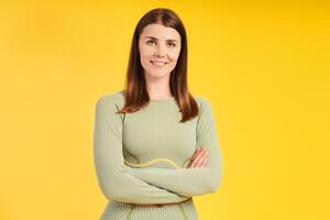 Confident, successful, smiling female athlete with crossed arms wearing stylish sports uniform photo