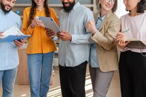 Diverse business team collaborating and discussing a project photo