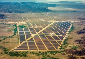 Aerial view of a sprawling solar farm with rows of panels absorbing sunlight in the desert photo