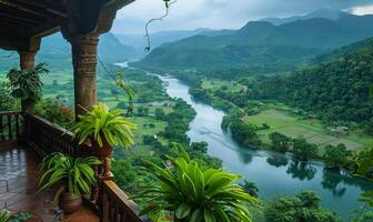 A panoramic view of a winding river through a lush valley, seen from a balcony of a highland retreat photo