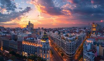 A panoramic cityscape featuring a mix of historical architecture and contemporary high-rises, illuminated by the setting sun photo