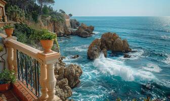 A picturesque seaside cliff with waves crashing against the rocks, viewed from a balcony with Mediterranean style photo