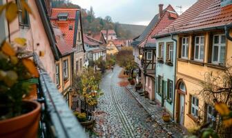 A quaint village with cobblestone streets and historic buildings, viewed from a balcony of a charming inn photo